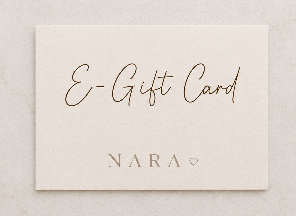NARA E-Gift Card — flat lay on marble surface showing script E-Gift Card lettering and NARA branding