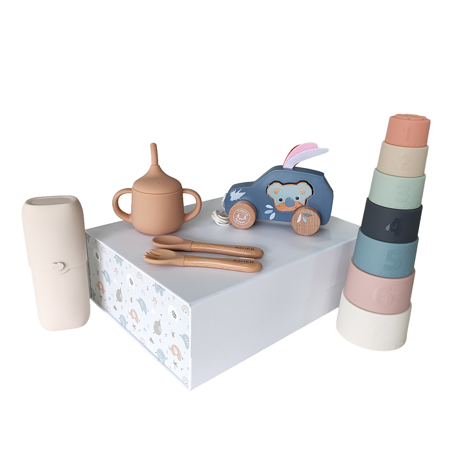 NARA × Speedy Monkey Pull-Along Car & Feeding Gift Set flatlay — Speedy Monkey koala pull-along car, silicone sippy cup, stacking cups, personalised spoon and fork, and cutlery case, styled on a white display plinth
