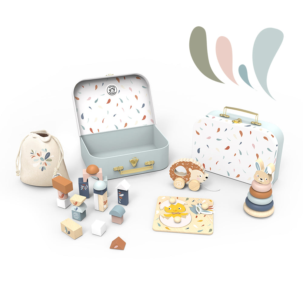 Personalised Speedy Monkey My First Toy Box — open suitcase with wooden building blocks, cotton drawstring bag and Scandinavian-inspired toys. Premium baby gift by NARA.