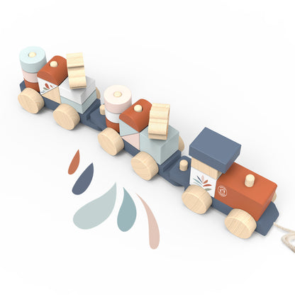 SPEEDY MONKEY Train Stacker overhead view — three-carriage wooden pull-along train fully stacked with colourful blocks in sage, blush, terracotta, and slate. Personalised baby gift by NARA.