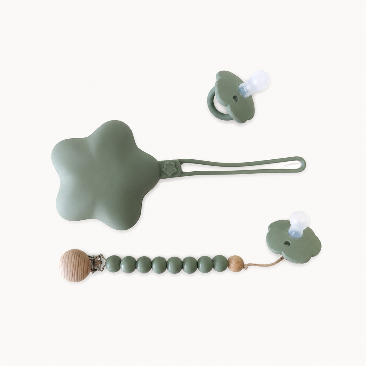 NARA Personalised Pacifier, Clip & Case Set in Sage Green — two silicone dummies, personalised wooden dummy clip and star-shaped silicone case, white background