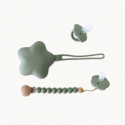 NARA Personalised Pacifier, Clip & Case Set in Sage Green — two silicone dummies, personalised wooden dummy clip and star-shaped silicone case, white background