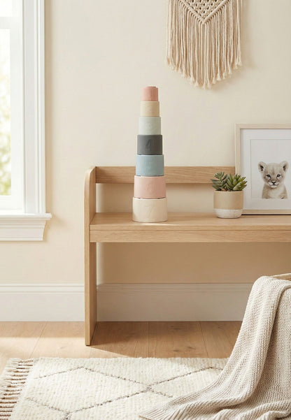 NARA Silicone Stacking Cups stacked on a wooden bench in a Scandi nursery