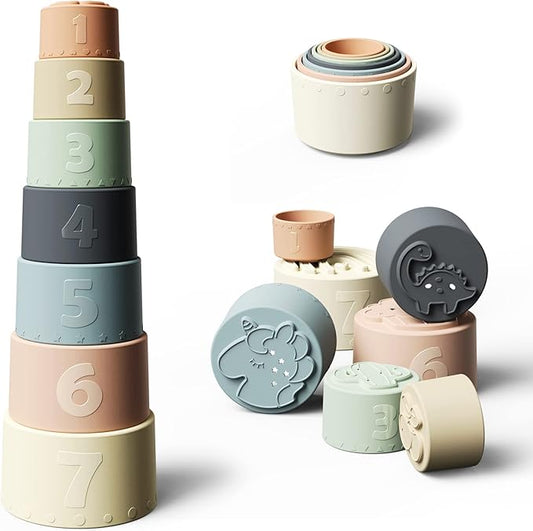 NARA silicone stacking cups — set of 7 numbered cups in muted Scandi tones with embossed animal bases, shown stacked as a tower and scattered