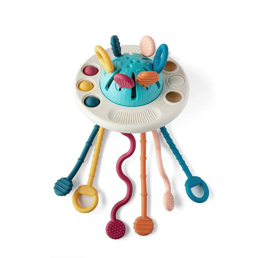 NARA UFO Pulling Toy — silicone sensory toy with six textured pull strings, pop-it buttons and pressable elements, white background