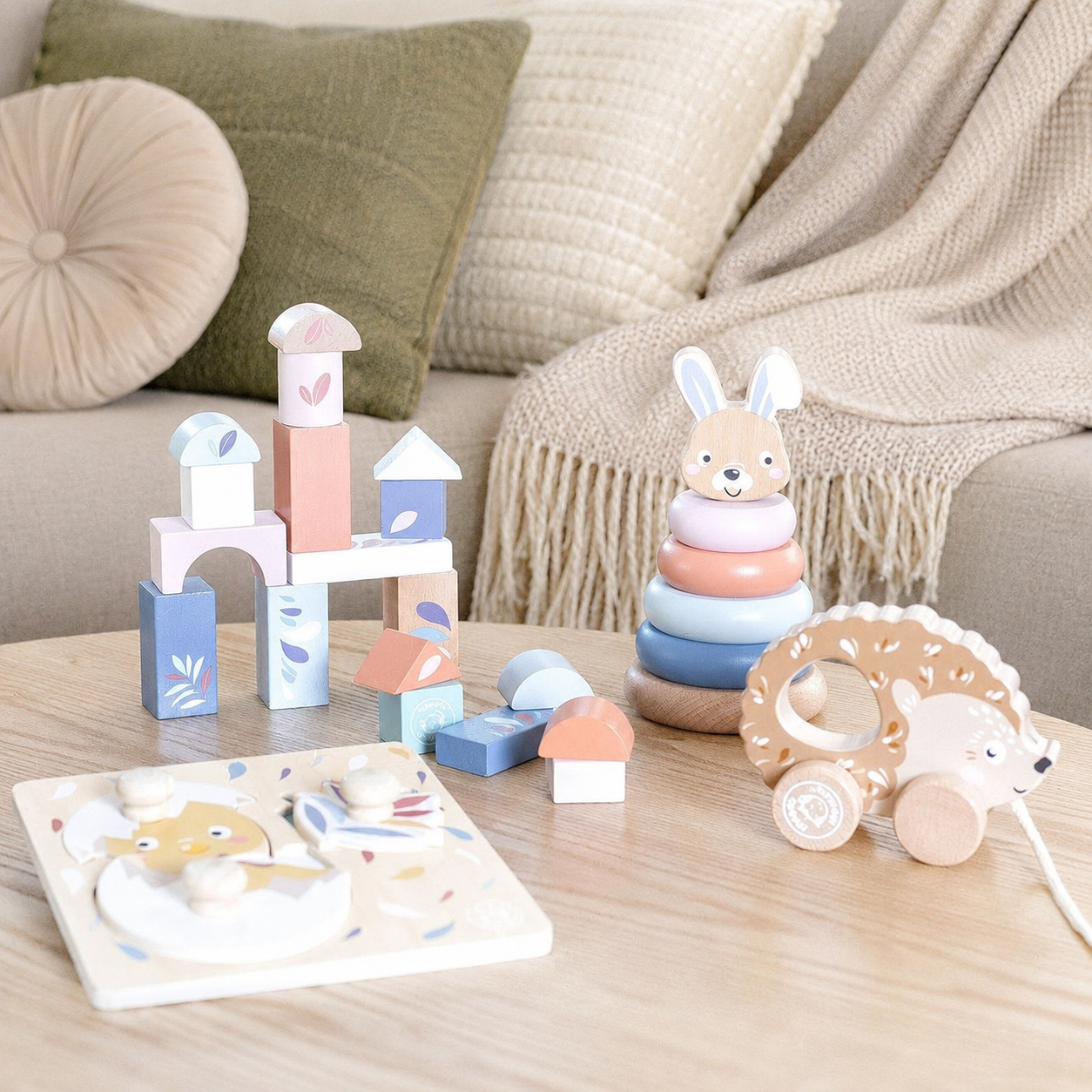 Speedy Monkey My First Toy Box contents — wooden building blocks castle, stacking rabbit, pull-along hedgehog and chick puzzle, FSC certified personalised wooden baby toys by NARA